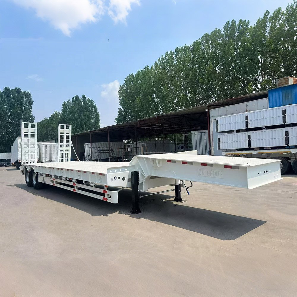 Lowbed semi trailer transporting heavy machinery