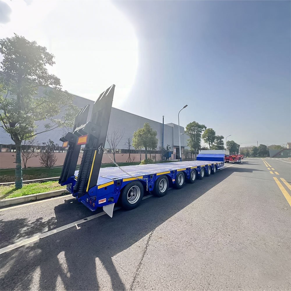 Extendable lowbed trailer carrying long heavy equipment