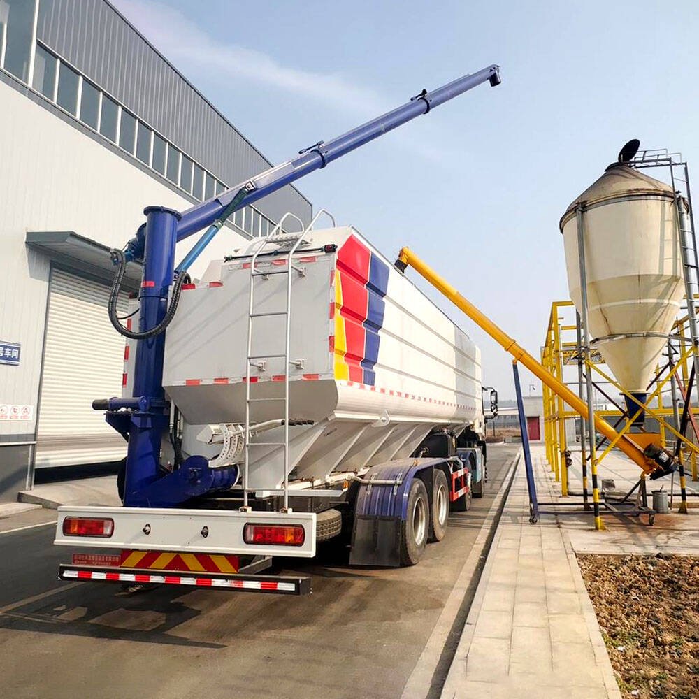 Bulk feed grain trailer transporting animal feed