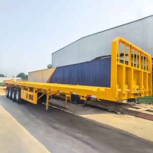ZW Group 4 Axle 80Ton Flatbed Semi Trailer with reinforced steel frame and front baffle plate for heavy cargo transport