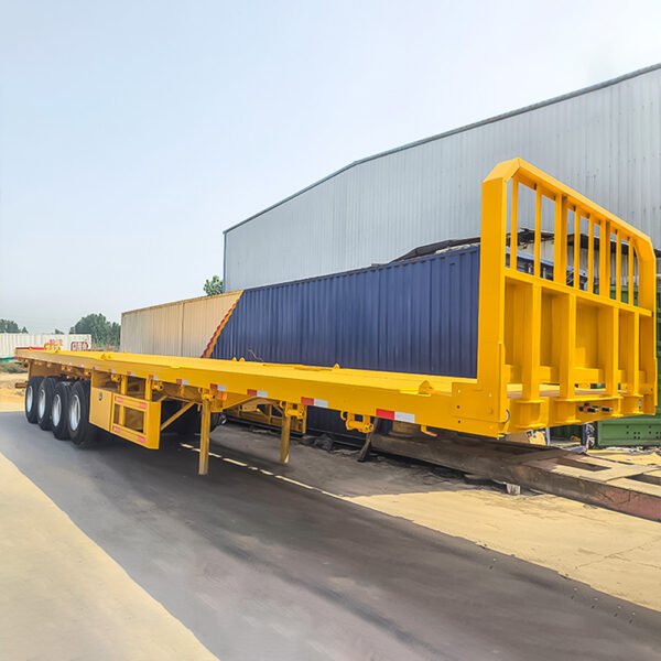 ZW Group 4 Axle 80Ton Flatbed Semi Trailer with reinforced steel frame and front baffle plate for heavy cargo transport