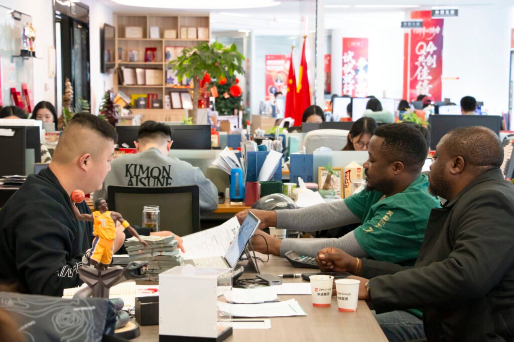 DR Congo clients discussing transport requirements with ZW Group export managers in the office