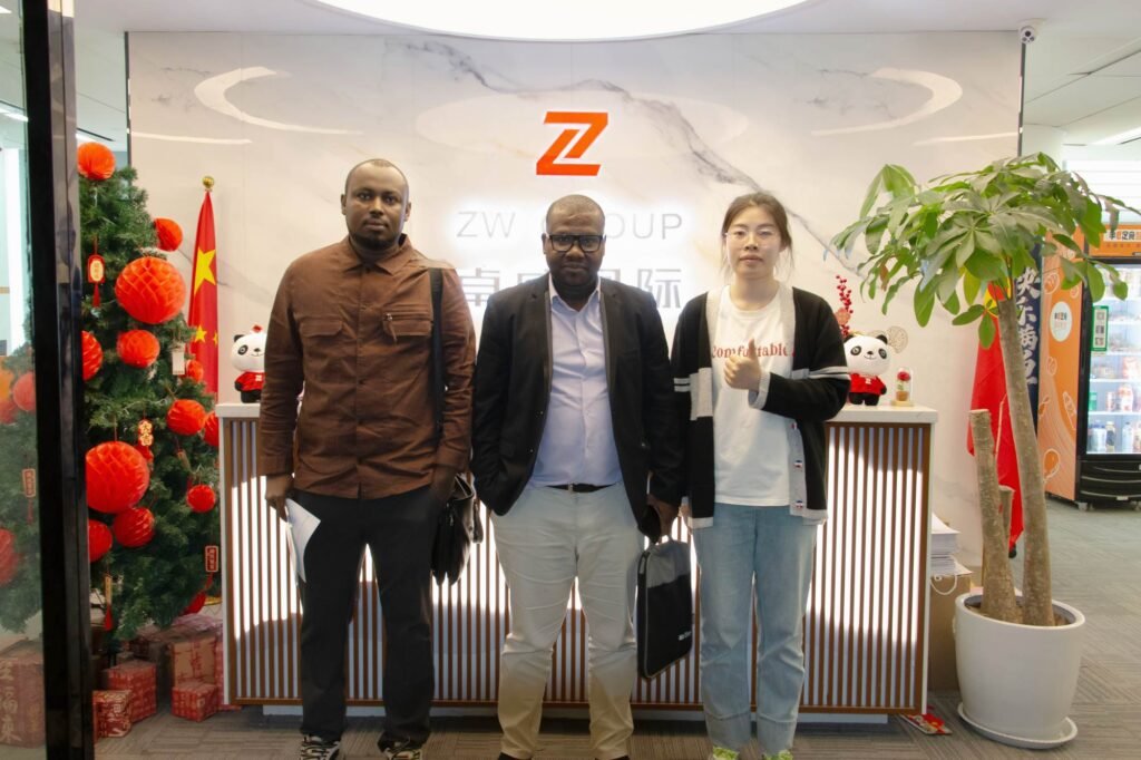ZW Group team with Mali client at company gate during flatbed semi trailer visit and cooperation meeting